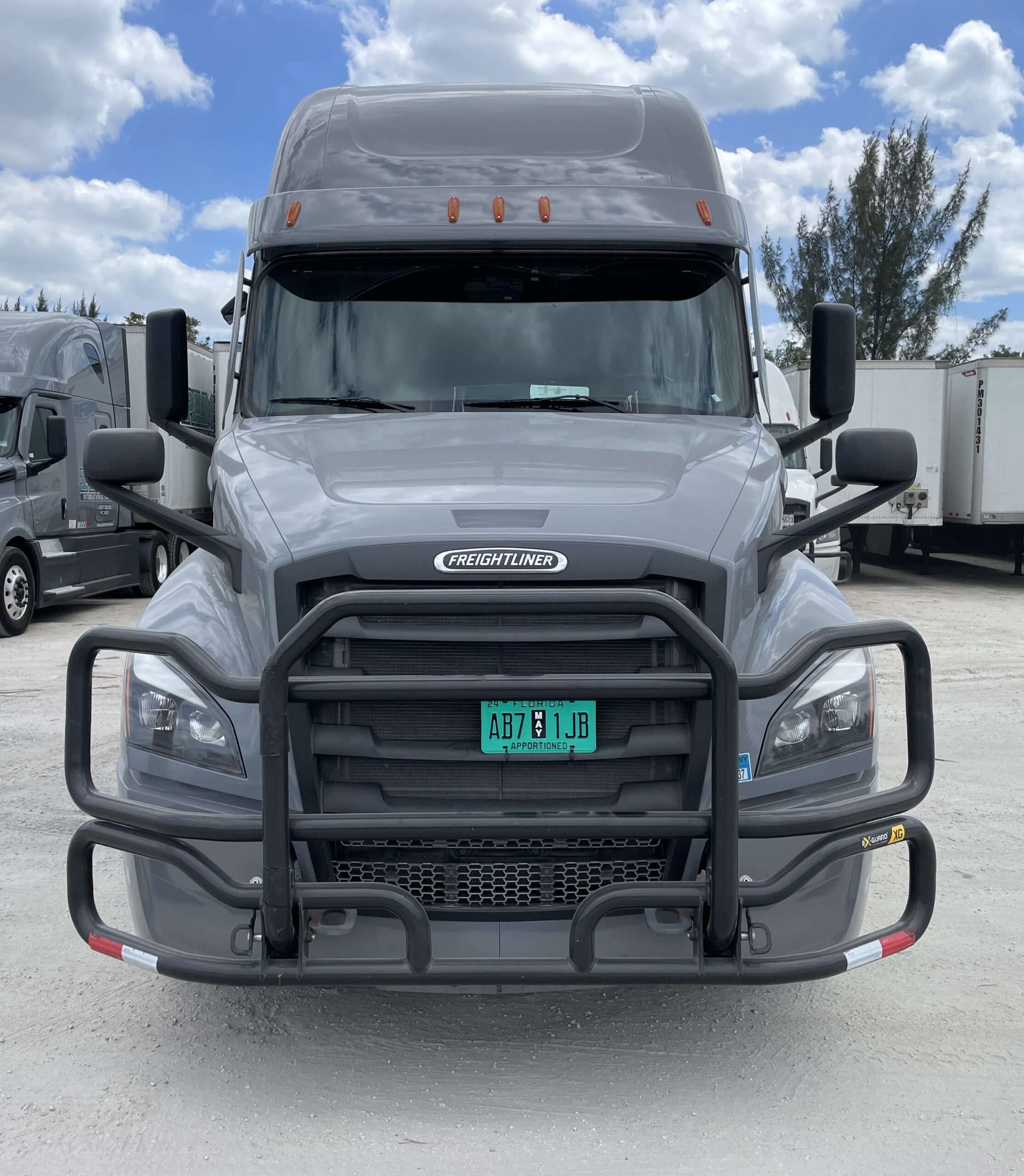Dry van freight being loaded into Pro Logistics Services Inc semi trucks at Miami yard